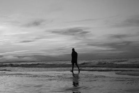 Man Walking on the Beach