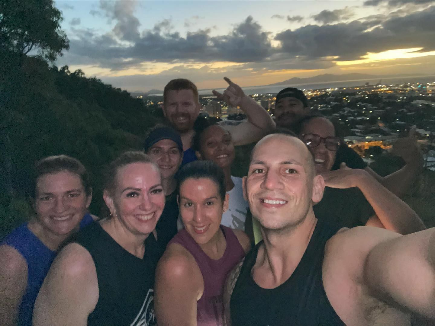A Group Of People Posing For A Selfie With A City In The Background — Elev8ed Fitness In Currajong, QLD