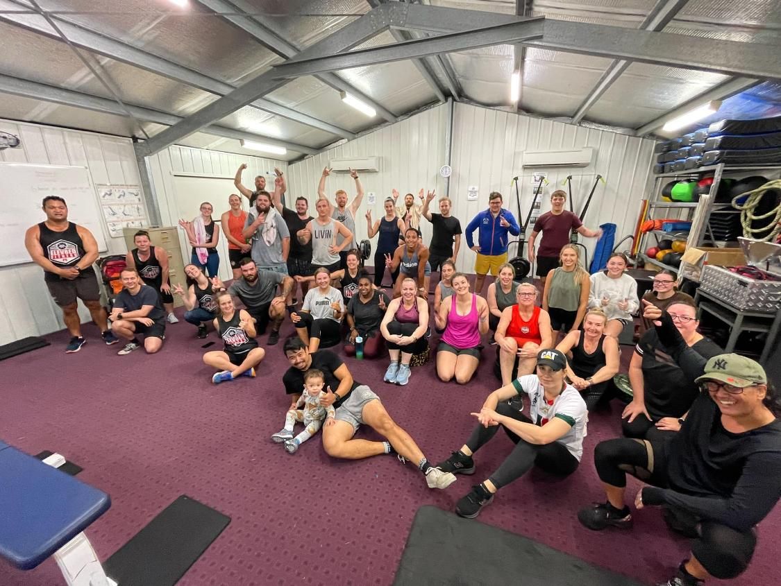 A Group Of People Are Posing For A Picture In A Gym — Elev8ed Fitness In Currajong, QLD
