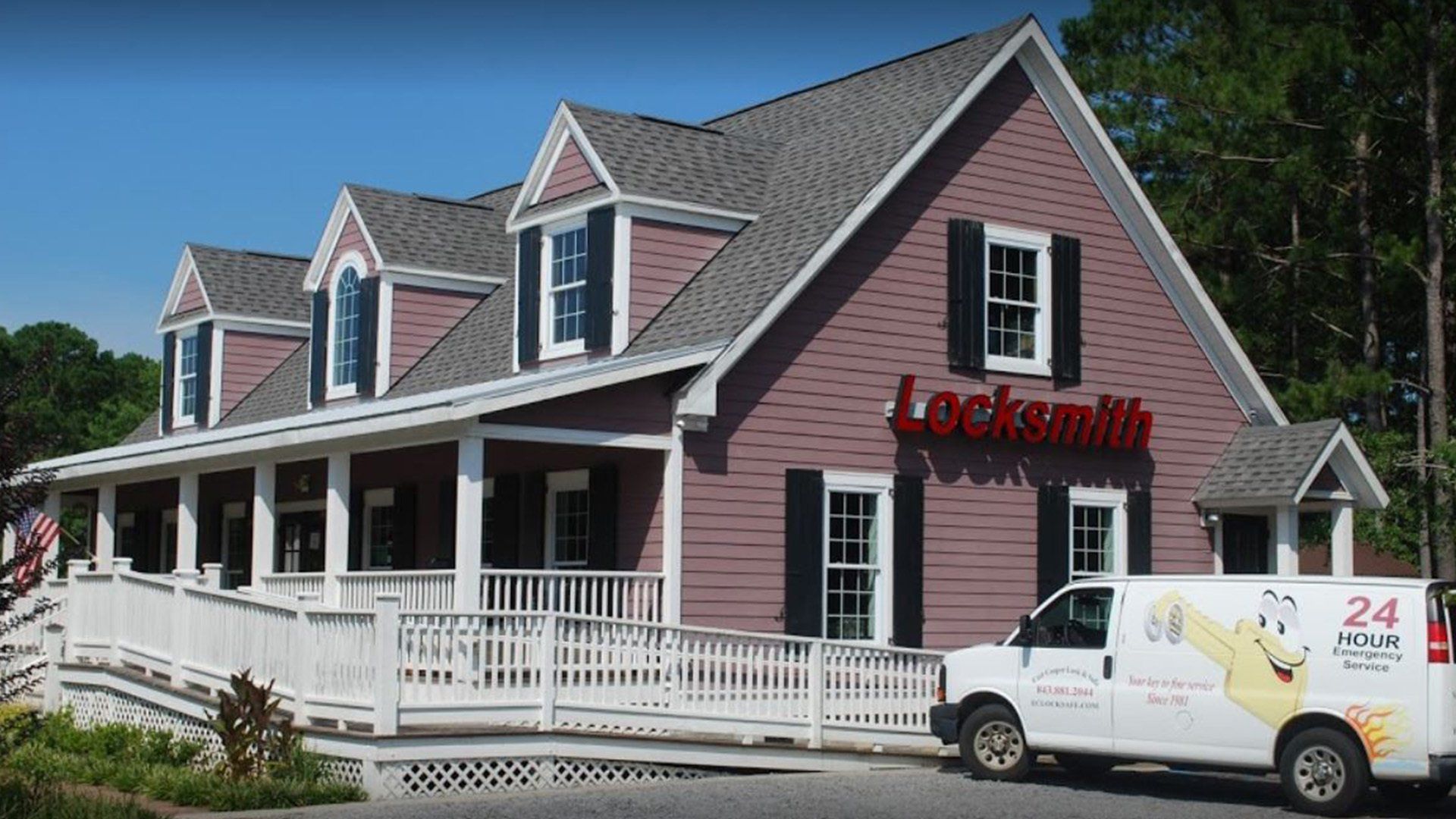 A pink house with a white van parked in front of it.