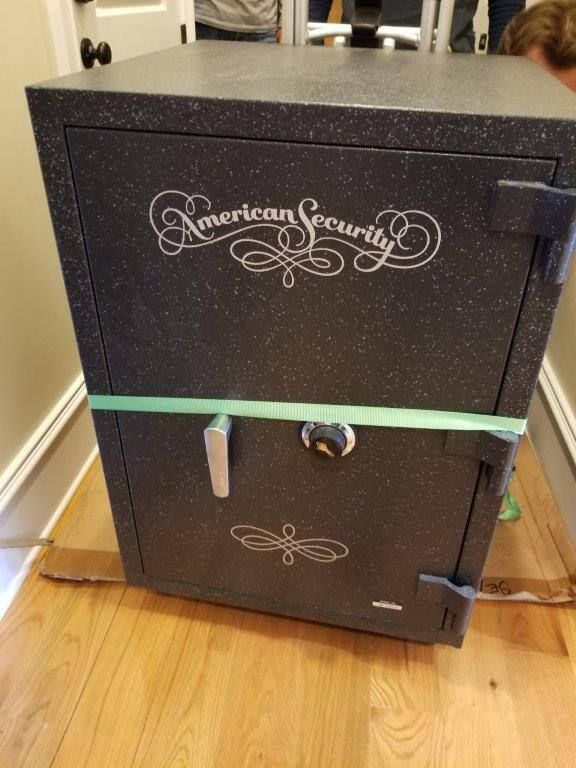 Two american security safes are stacked on top of each other