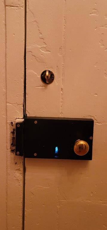 A close up of a door with a lock on it.