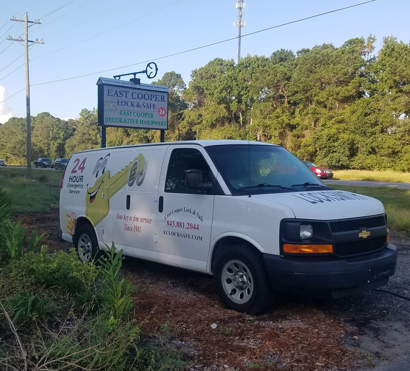 A white van is parked on the side of the road