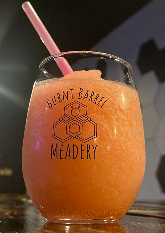Orange Mead Drink With Straw — Lake St. Louis, MO — Burnt Barrel Meadery & Distillery