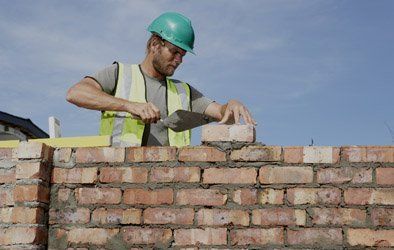   man laying bricks 