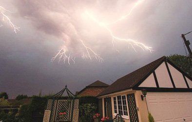   lightning above rooftops 