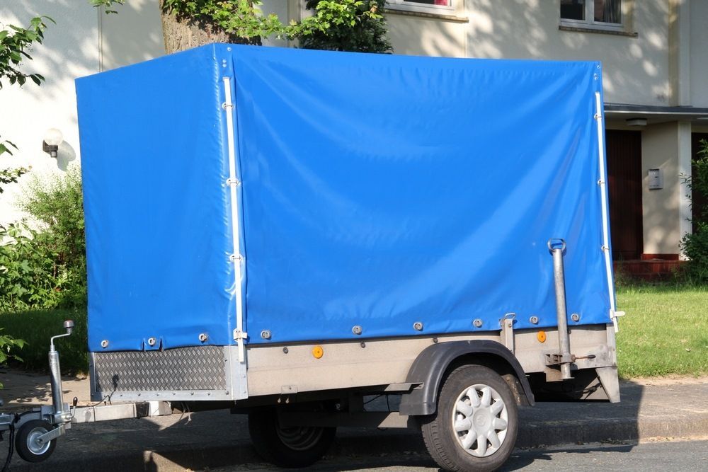 Blue Tarp Covered Trailer Parked On A Road — Canobolas Canvas In Orange, NSW