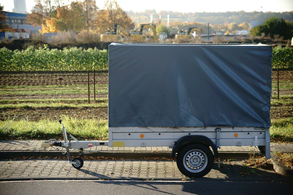 Gray Trailer With A Covered Tarp On A Roadside — Canobolas Canvas In Orange, NSW