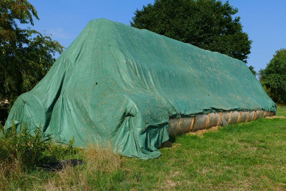 Green Tarp Covering Hay Bales — Canobolas Canvas In Orange, NSW