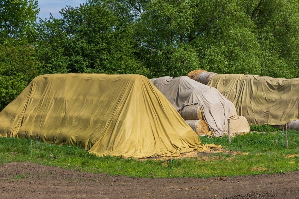 Hay Bales Covered With Yellow and Tan Tarps — Canobolas Canvas In Orange, NSW