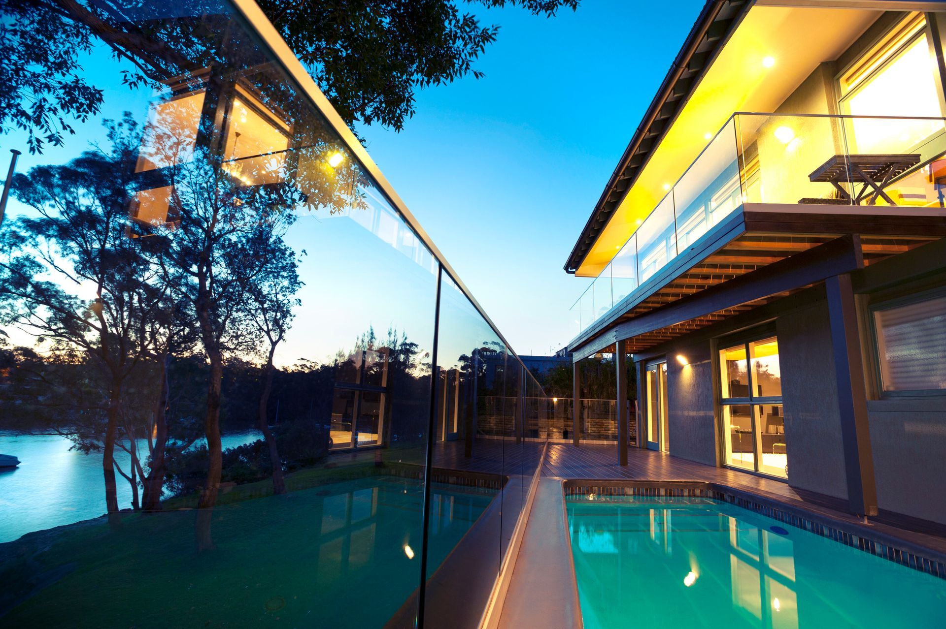 Waterfront house with swimming pool at sunset | Penrith NSW 