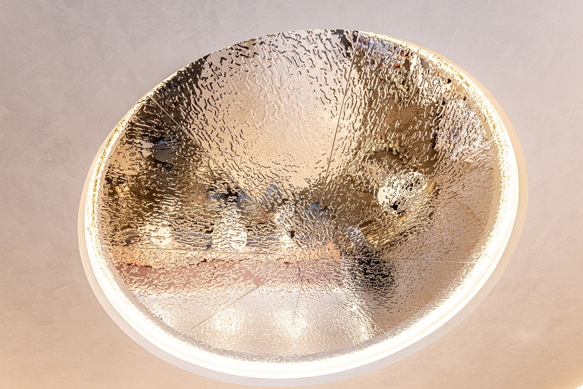 A close-up of a circular skylight on a ceiling
