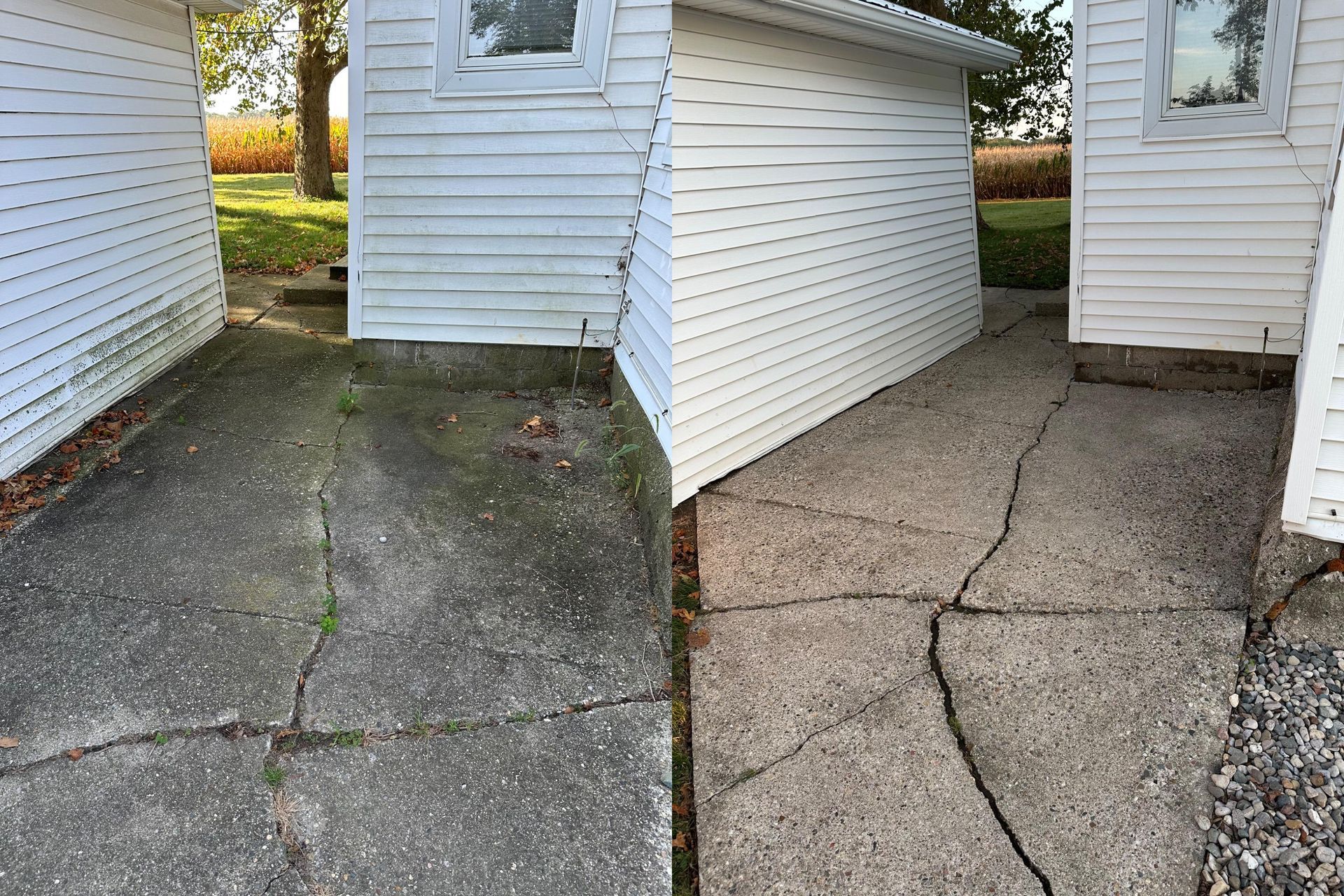 Cracked concrete walkway beside white-sided buildings and a small sloped ramp.