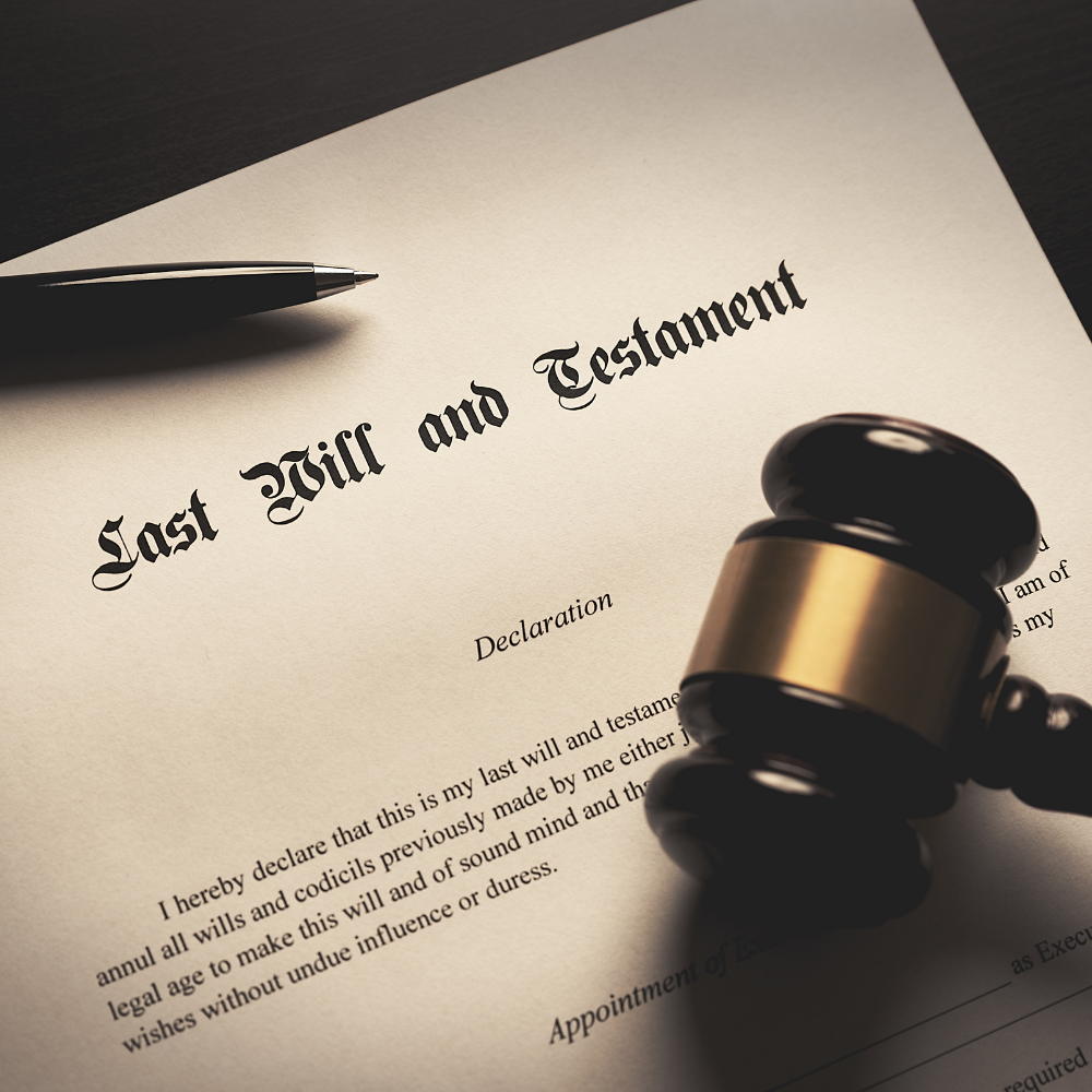 A Last Will and Testament document with a gavel and pen, likely signifying legal and estate planning.