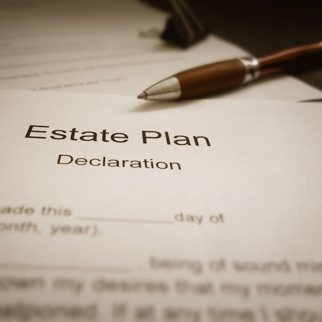 Estate plan document with a pen on top, ready for signing.