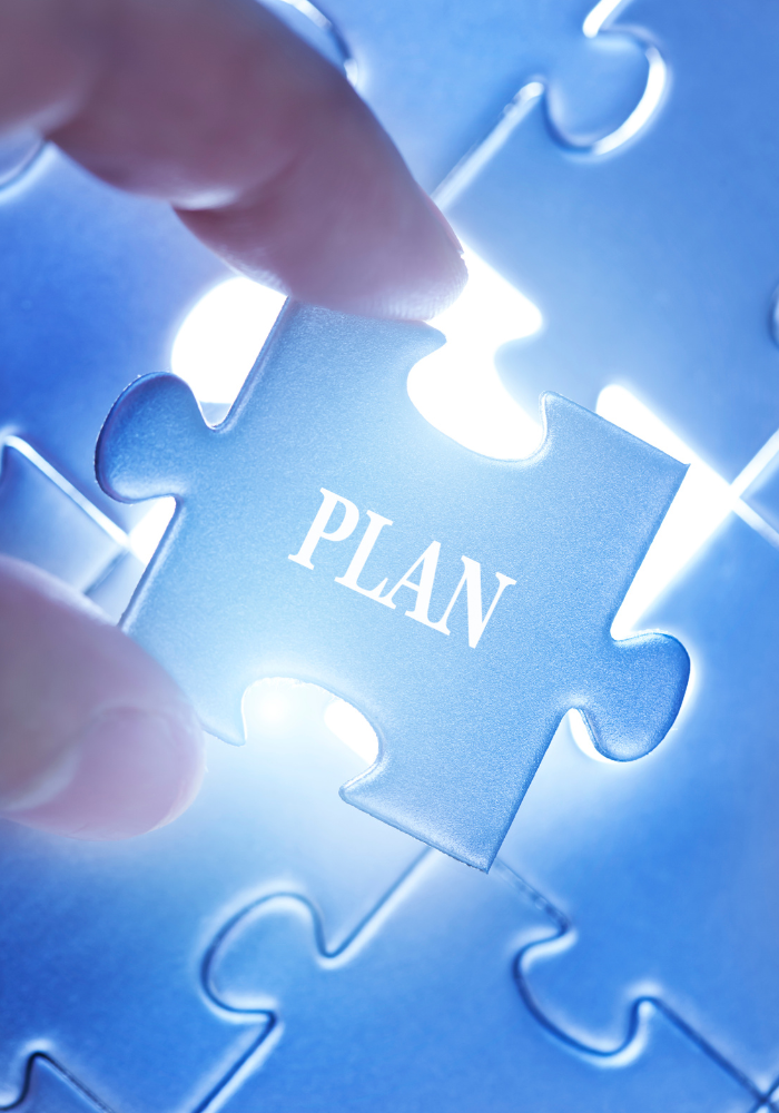 Hand placing a blue puzzle piece with the word 