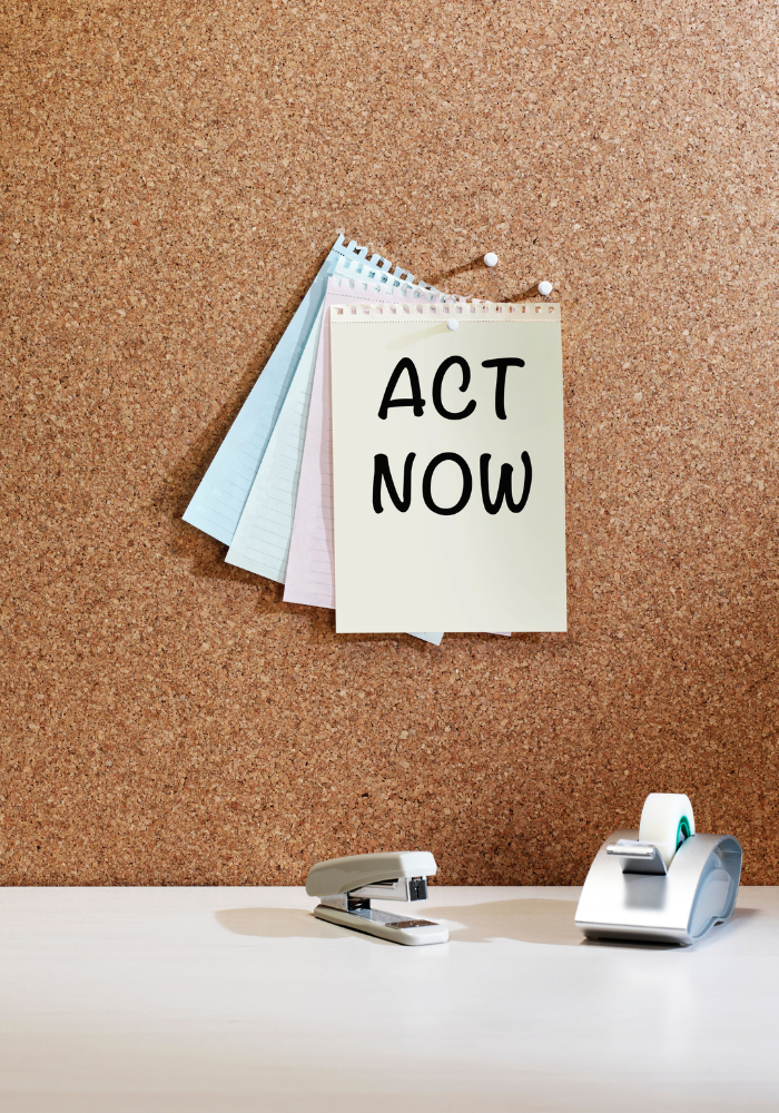 Corkboard with notepad saying 