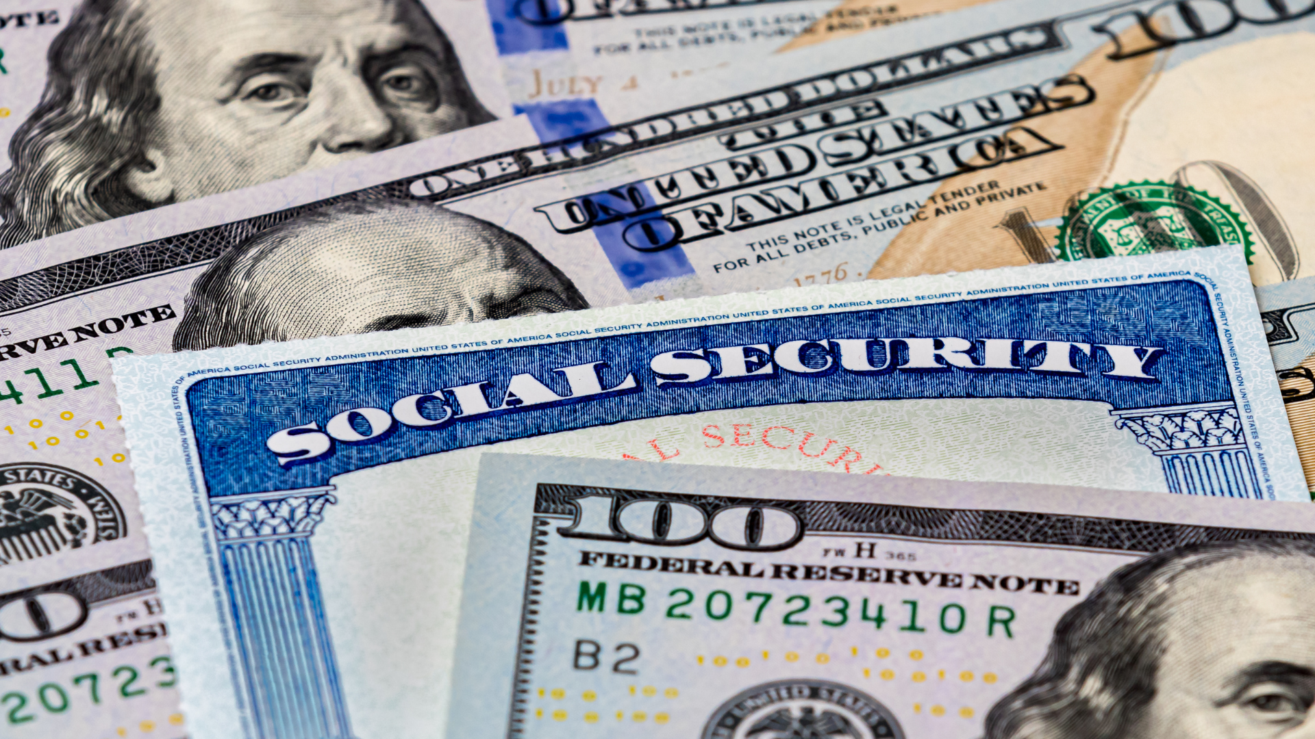 Social Security card with US $100 bills, symbolizing retirement or financial support.