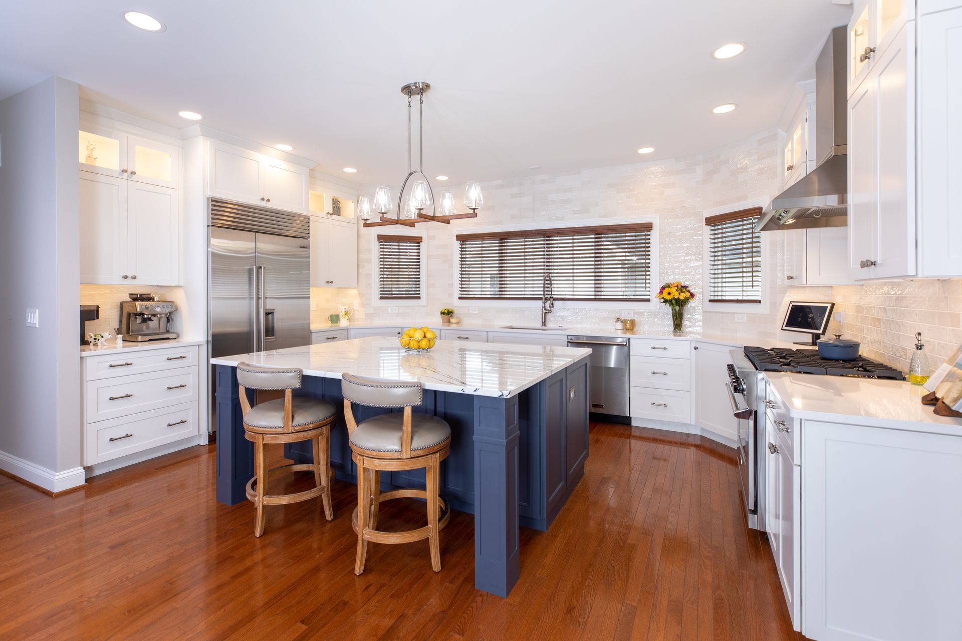A dining room with a round table and chairs