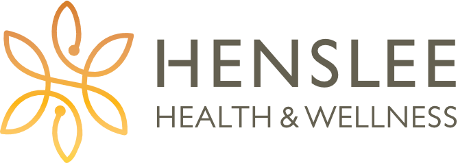 the henslee health and wellness logo has a flower on it .
