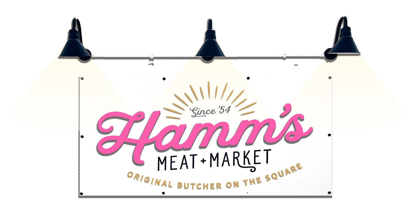 A hamm 's meat market sign is hanging from the ceiling.