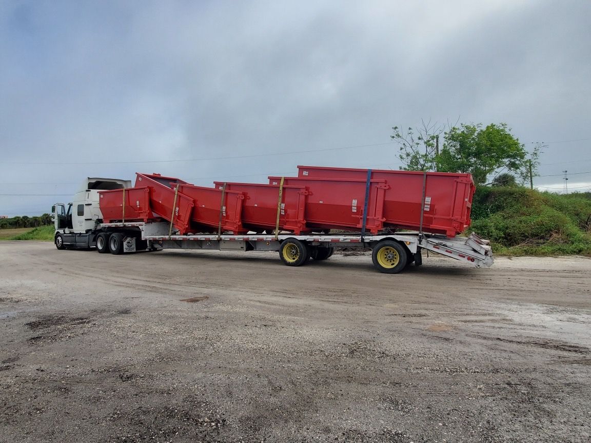 Transporting Dumpsters — Melbourne, FL — Braggs Roll-Off Dumpsters Inc.