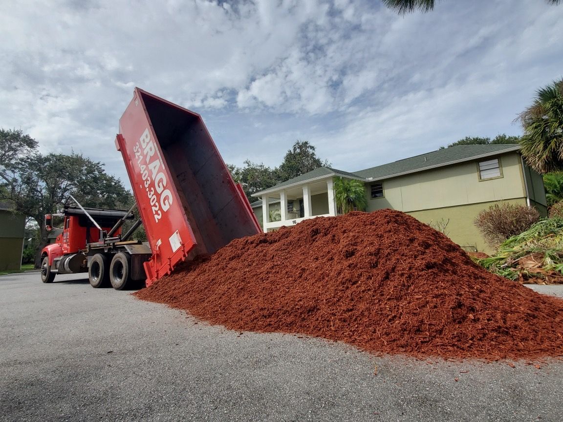 Unloading Soil — Melbourne, FL — Braggs Roll-Off Dumpsters Inc.