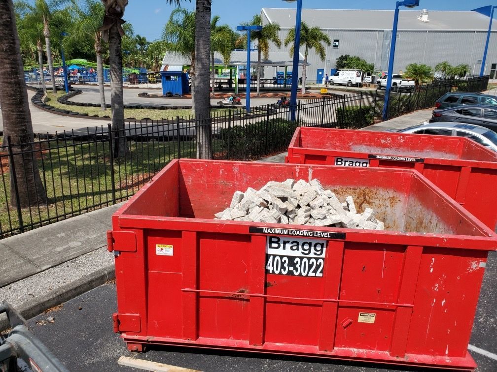 Dumpster with Debris — Melbourne, FL — Braggs Roll-Off Dumpsters Inc.