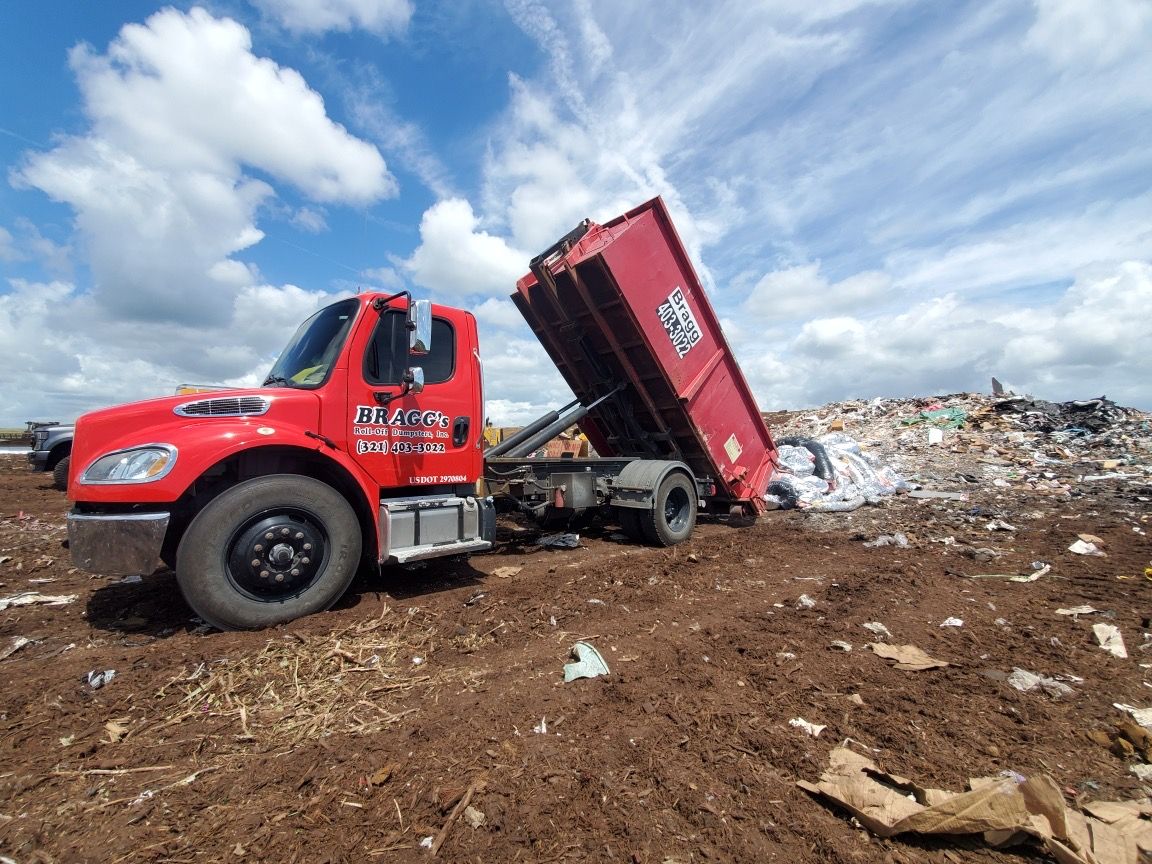 Dumping waste on Landfill — Melbourne, FL — Braggs Roll-Off Dumpsters Inc.