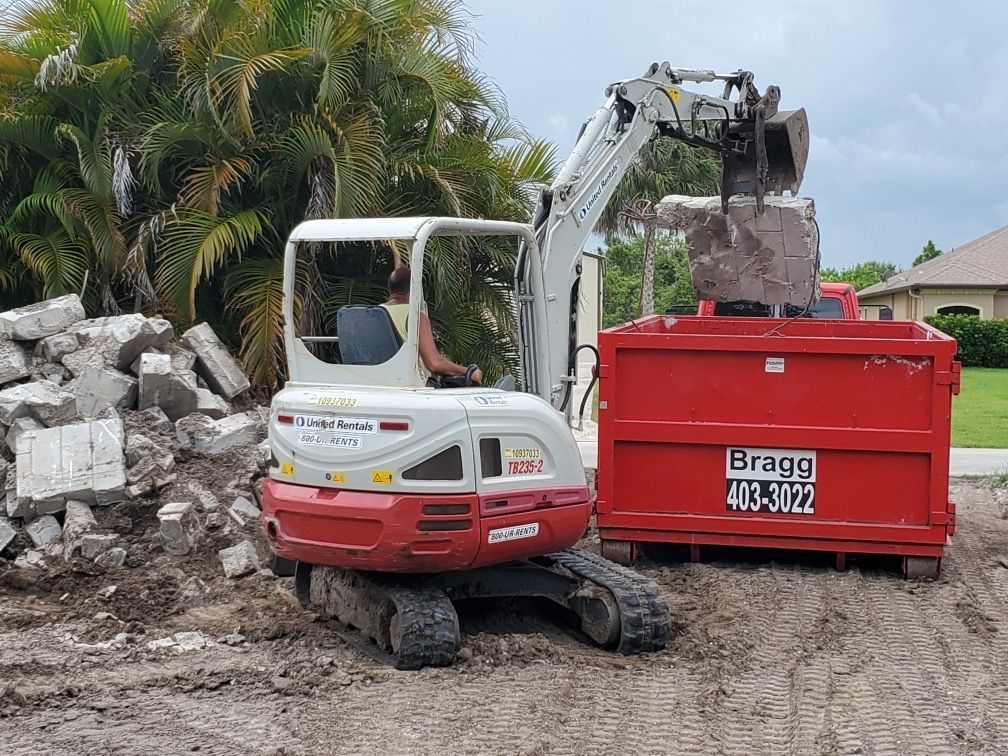 Filling Up Dumpster of Construction Debris — Melbourne, FL — Braggs Roll-Off Dumpsters Inc.