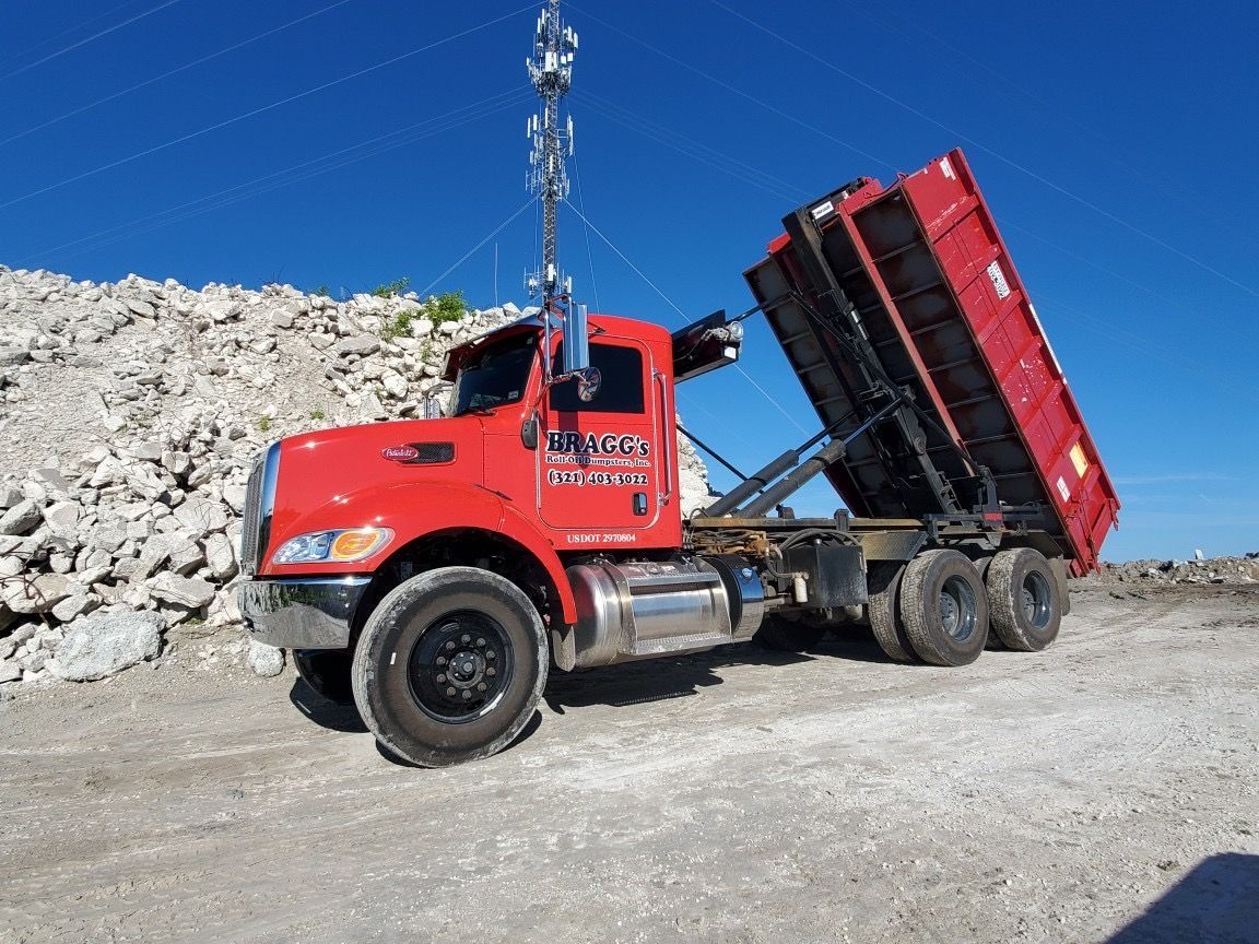 Bragg's Dumping Truck — Melbourne, FL — Braggs Roll-Off Dumpsters Inc.