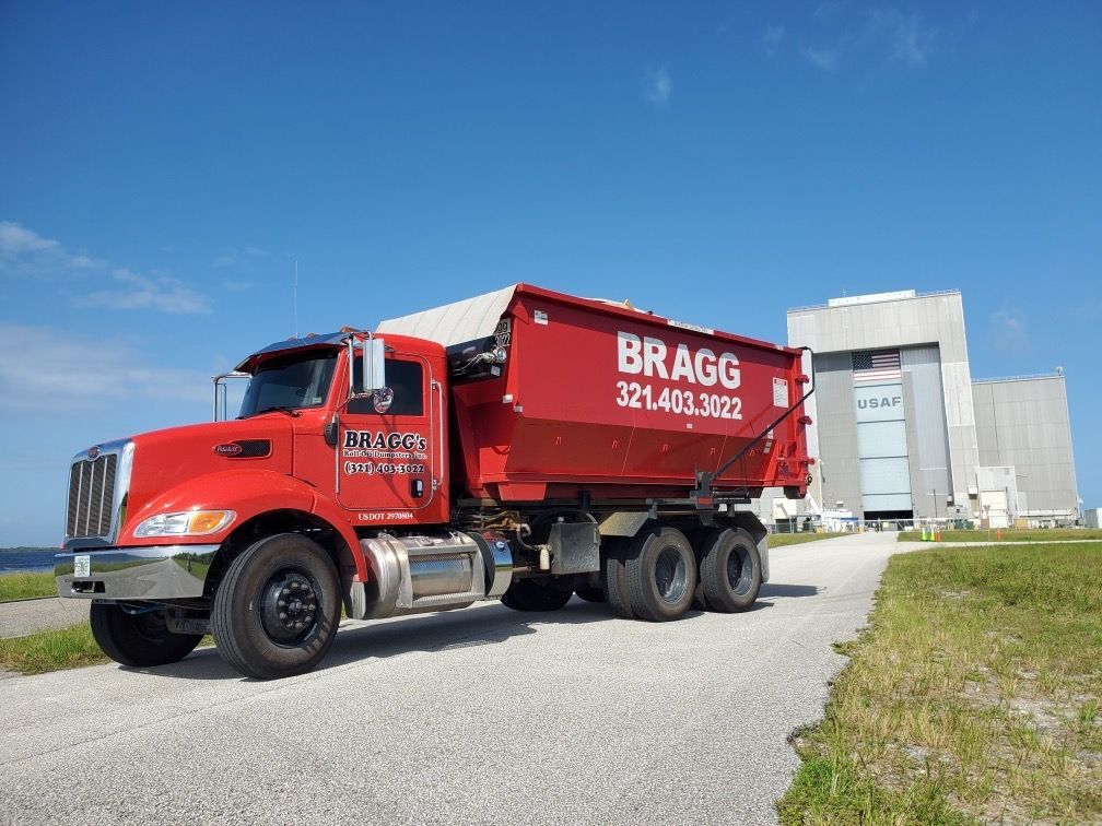 Bragg's Dump Truck — Melbourne, FL — Braggs Roll-Off Dumpsters Inc.