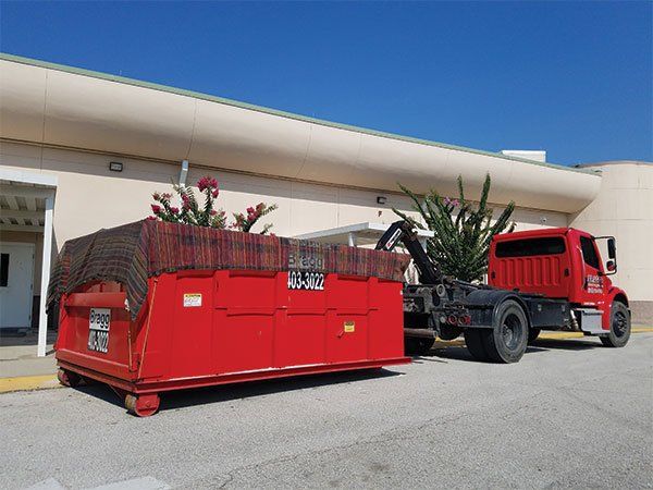 Commercial Dumpster Rentals  — Back of Red Truck in Melbourne, FL