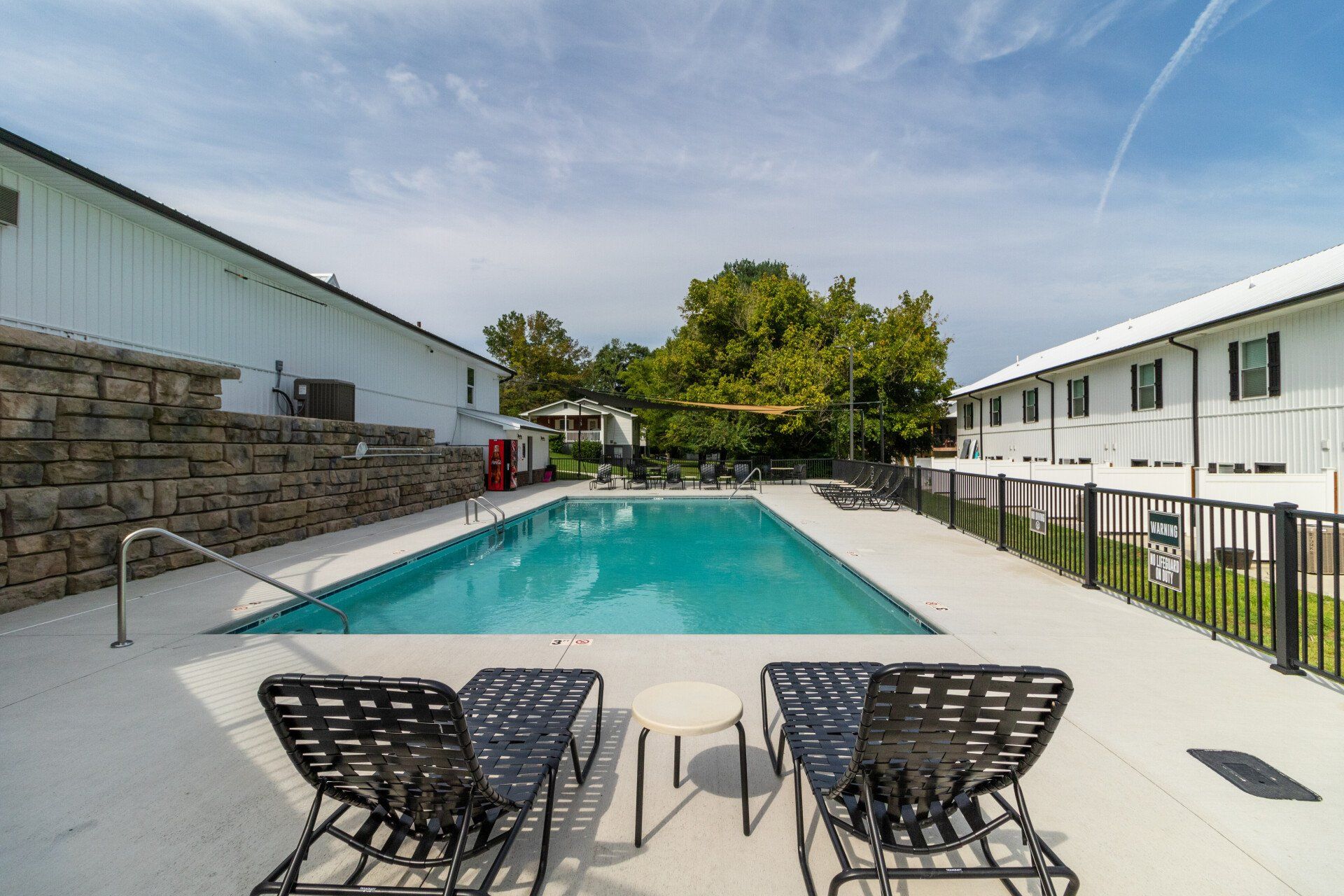 Outdoor pool with lounge chairs