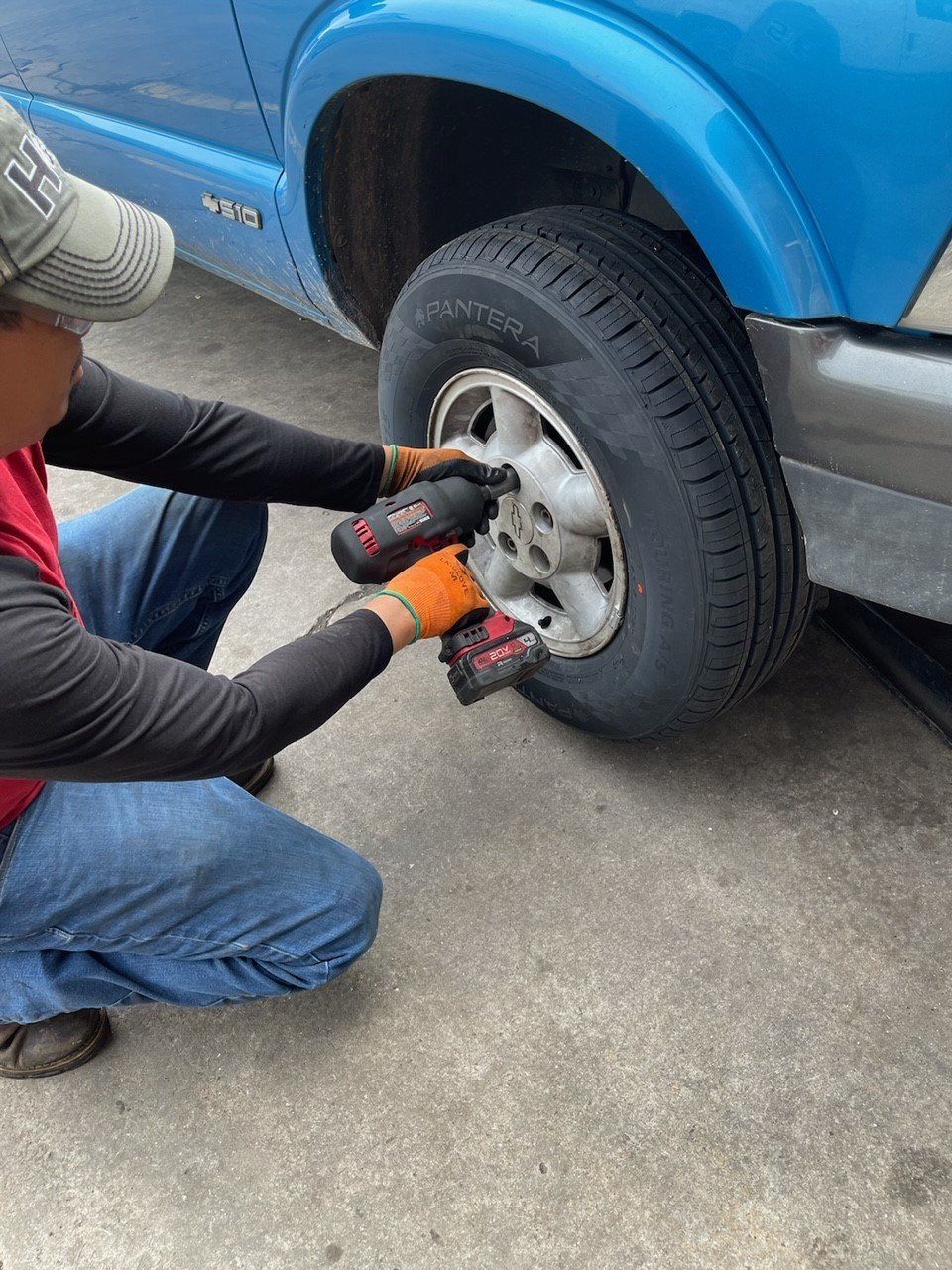 Man Fixing Lady's Car — Sevierville, TN — Sevierville Discount Tire