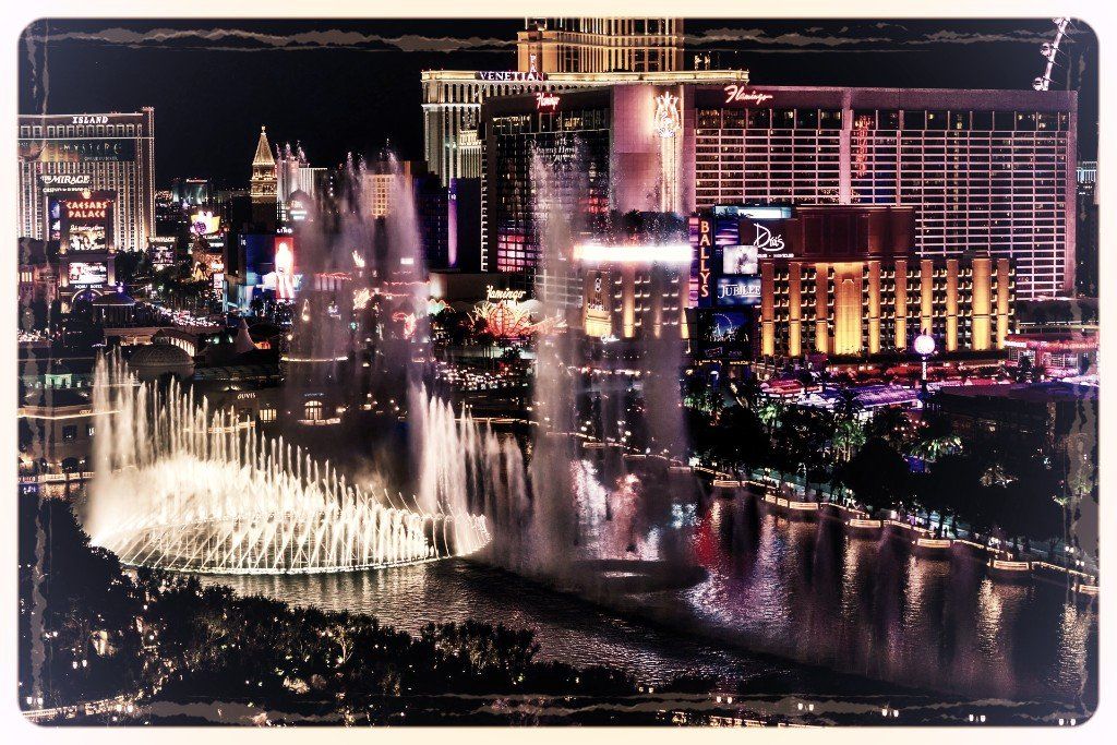 A waterfall in the middle of a city at night