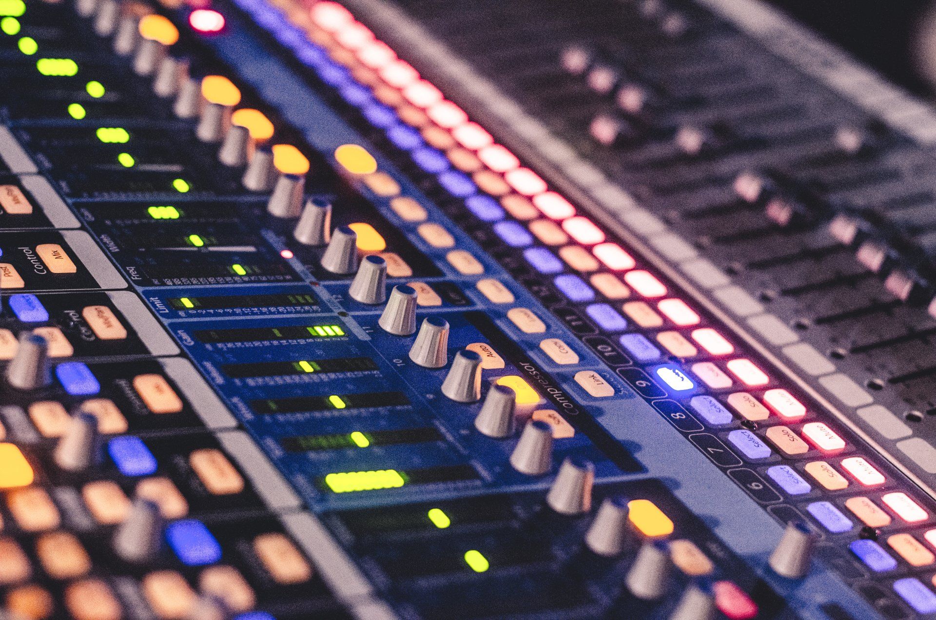 A close up of a mixer with a lot of buttons and lights on it.