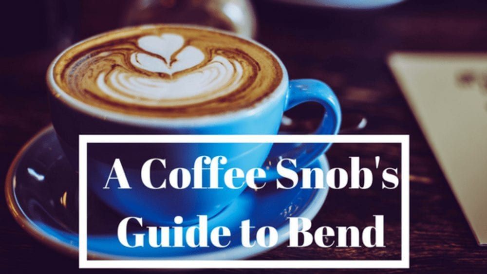 A cup of coffee on a saucer with the words a coffee snob 's guide to bend