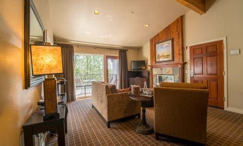 A living room filled with furniture and a fireplace.