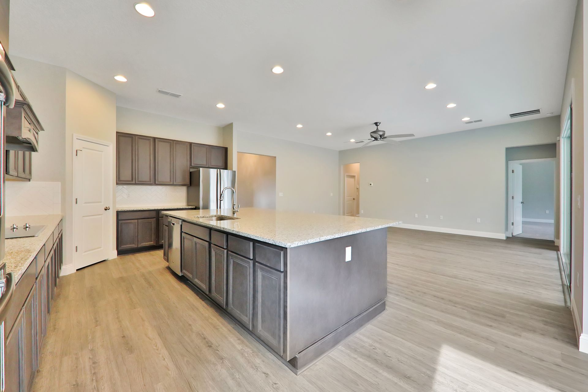 There is a large island in the middle of the kitchen.