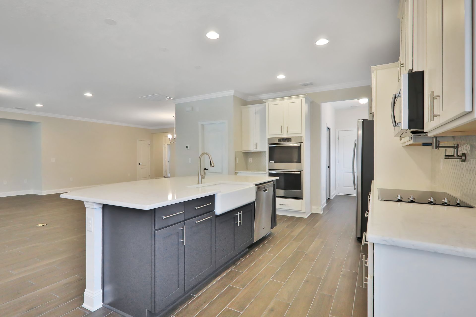 A kitchen with a large island in the middle of the room.