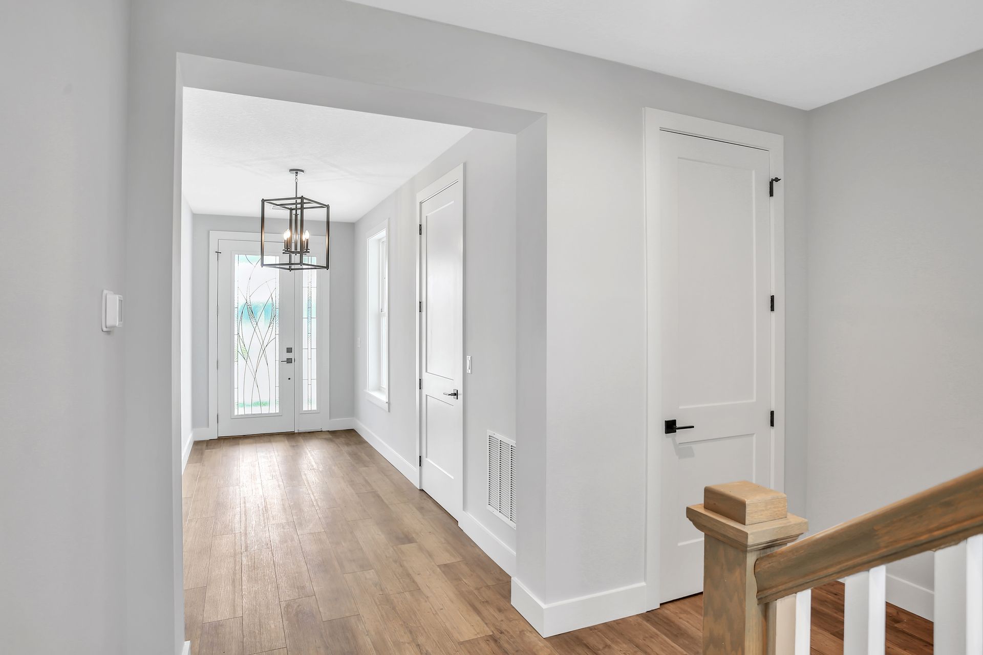 There is a staircase leading up to the second floor of a house.