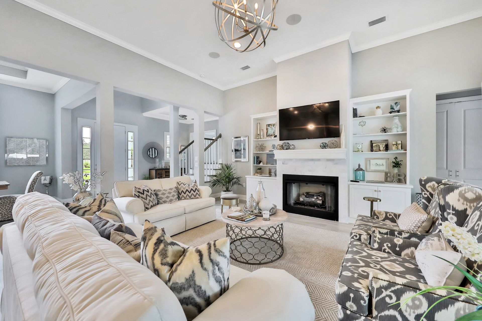 A living room filled with furniture and a fireplace.