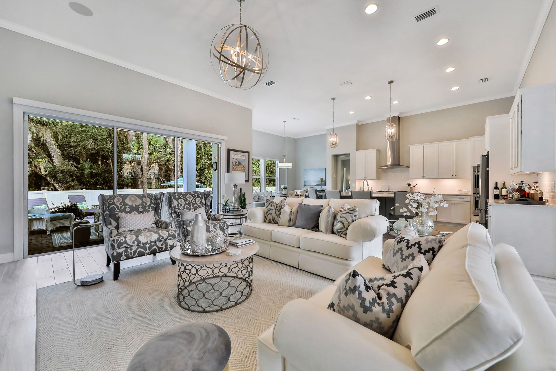 A living room with a couch , chairs and a coffee table