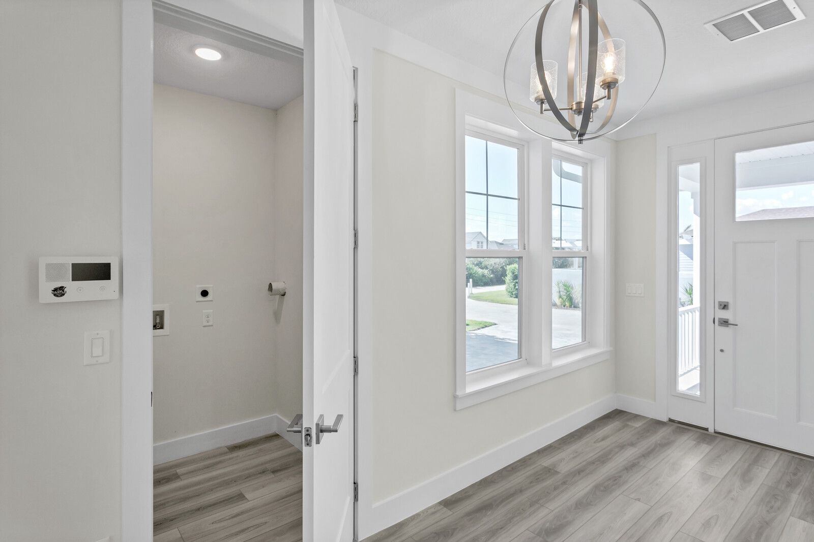 There is a laundry room in the middle of the room.