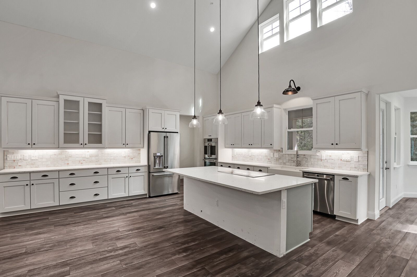 There is a large island in the middle of the kitchen.