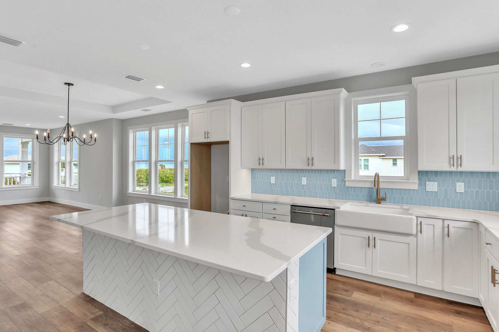 There is a large island in the middle of the kitchen.