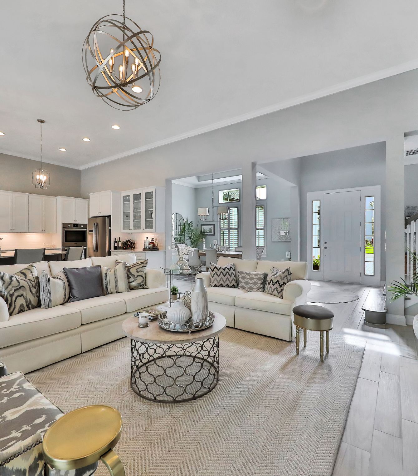 A living room filled with furniture and a chandelier.