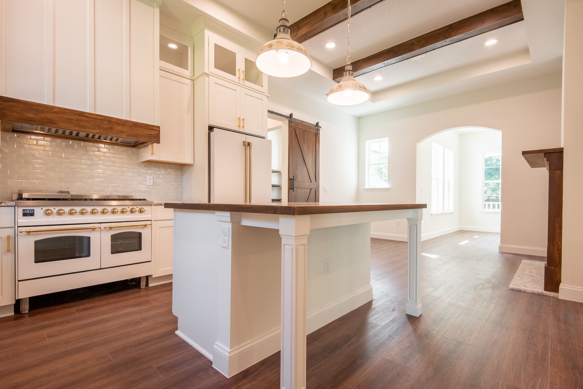 There is a large island in the middle of the kitchen.