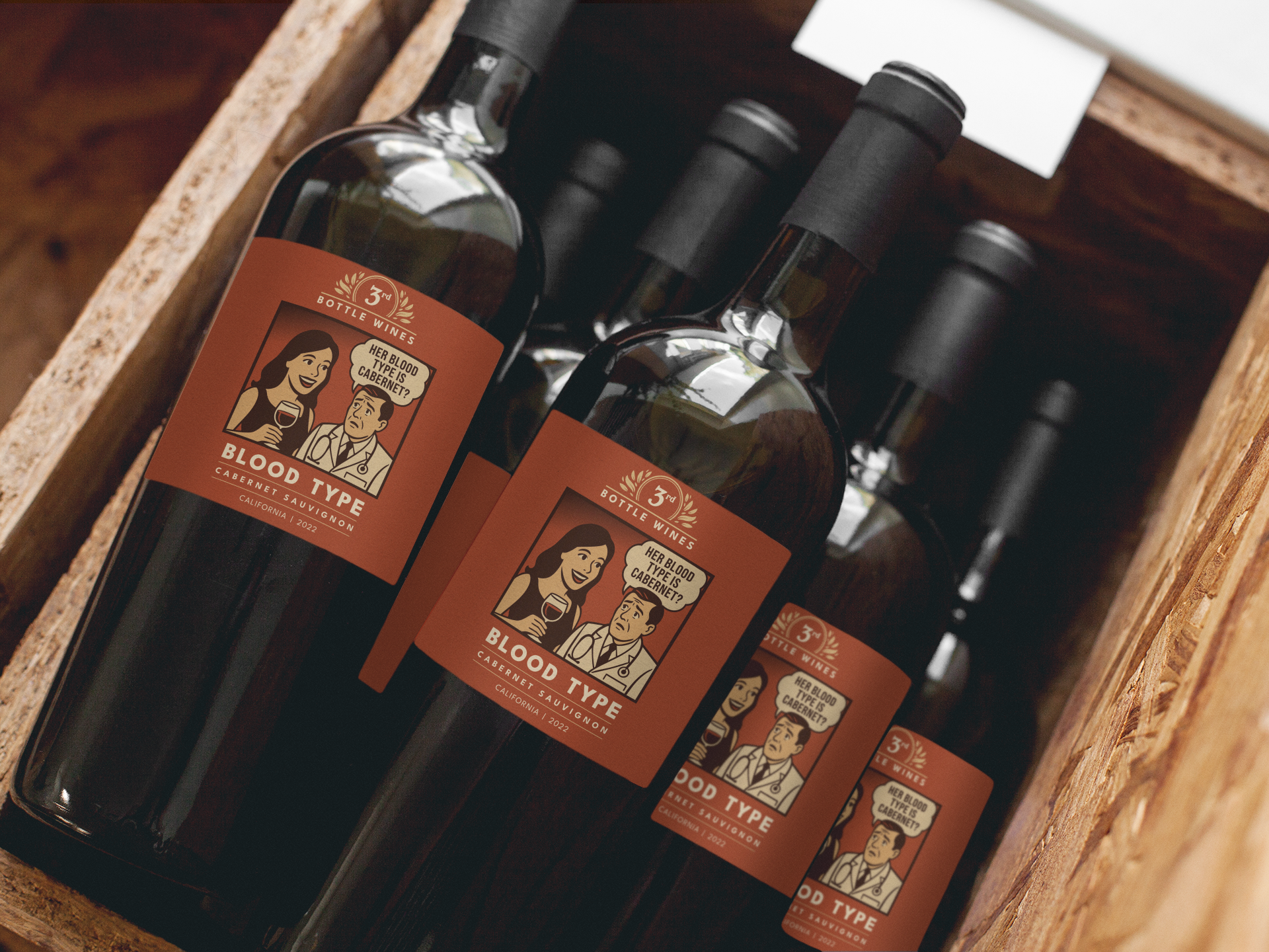 Bottles of red wine in a wooden crate, labeled 